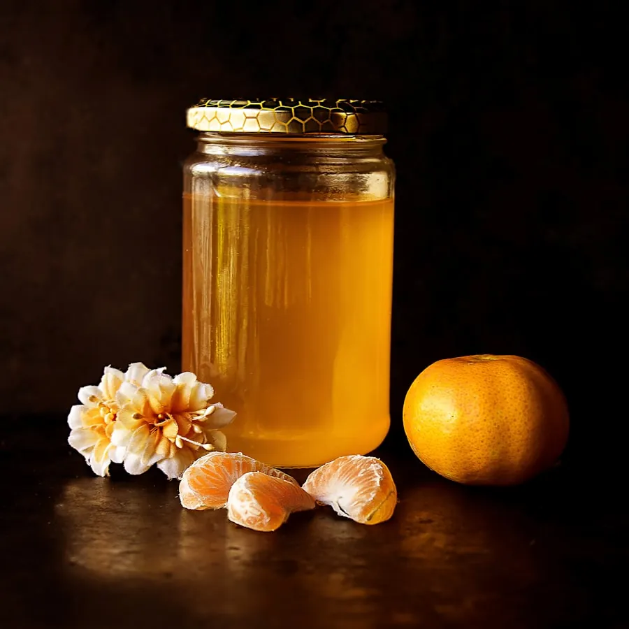 A rustic jar of raw honey