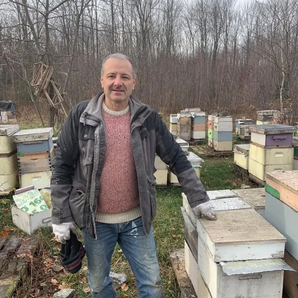 Todor Donchev, master beekeeper and founder of Miel D'or, among his hives